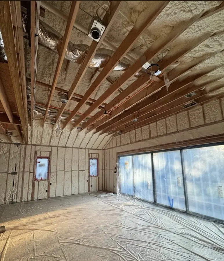 Interior walls and ceiling insulated with spray foam during new construction in Garden City